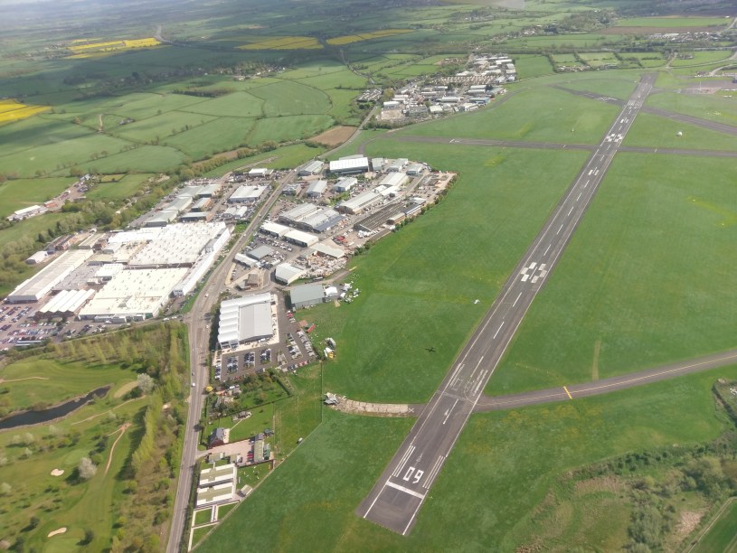 A plane takes off below us, Gloucester airport